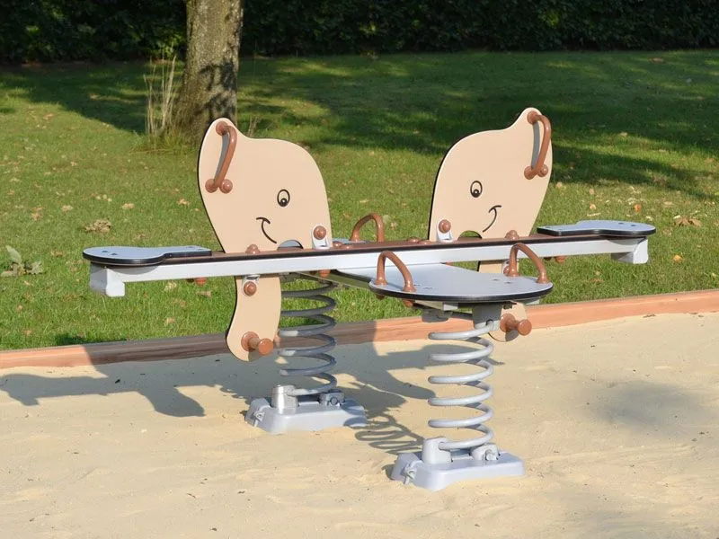 Spring seesaw elephants on a playground in the sand Spring seesaw elephants on a playground in the sand